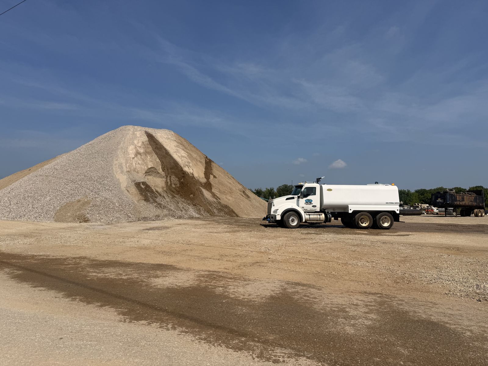 Material stockpile and water truck in the Brown Bros. yard